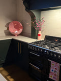Pastel pink bioethanol fireplace for modern living room spaces in kitchen
